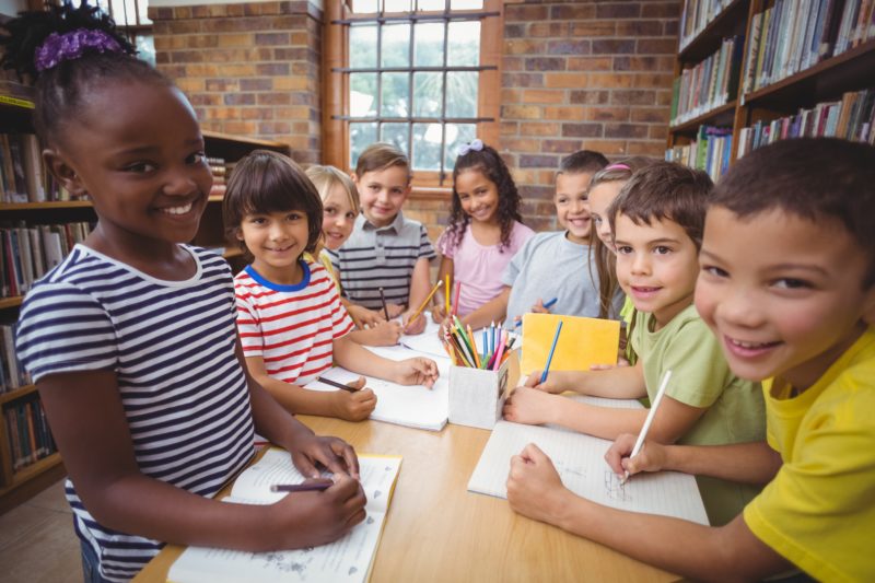 Students working together building communities in class.