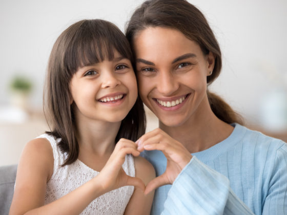 Mother and daughter showing caring