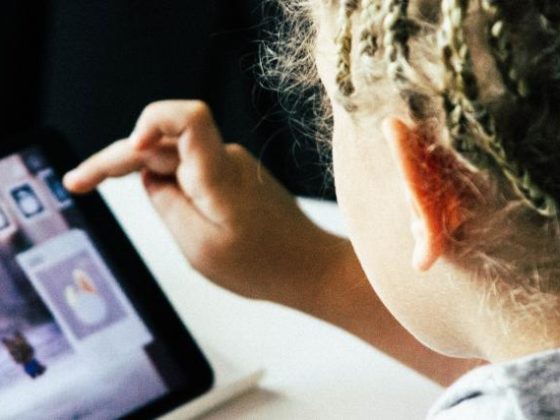 Child learning on a tablet.