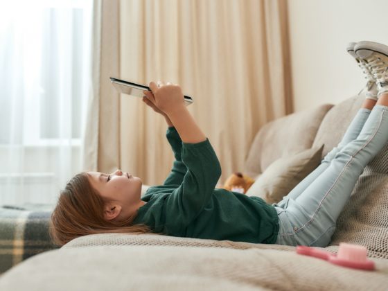 Girl reading on couch