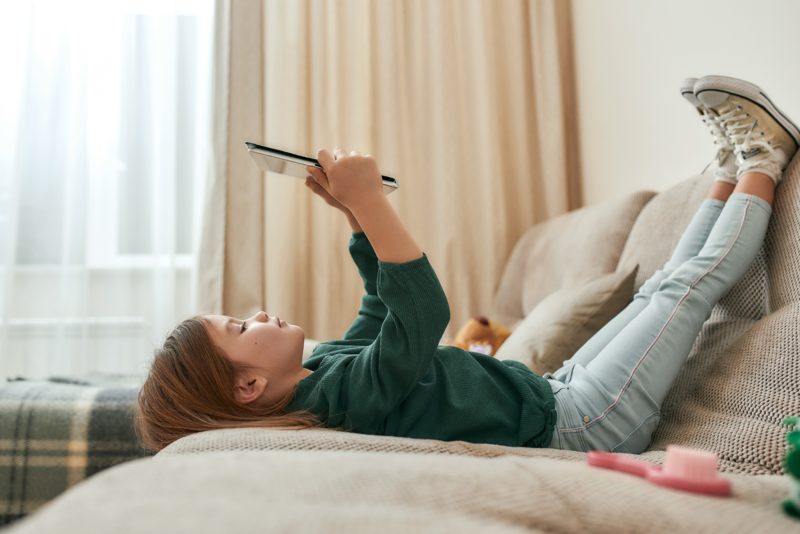 Girl reading on couch