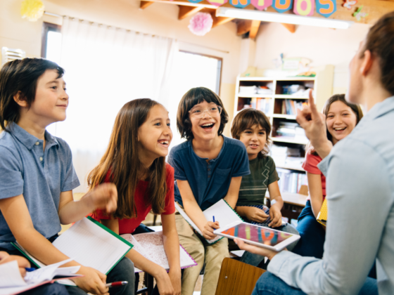 Teacher using the Epic reading platform with students, showing how teachers inspire reading in the classroom.