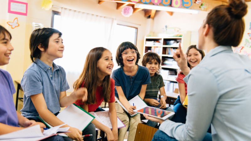 Teacher using the Epic reading platform with students, showing how teachers inspire reading in the classroom.