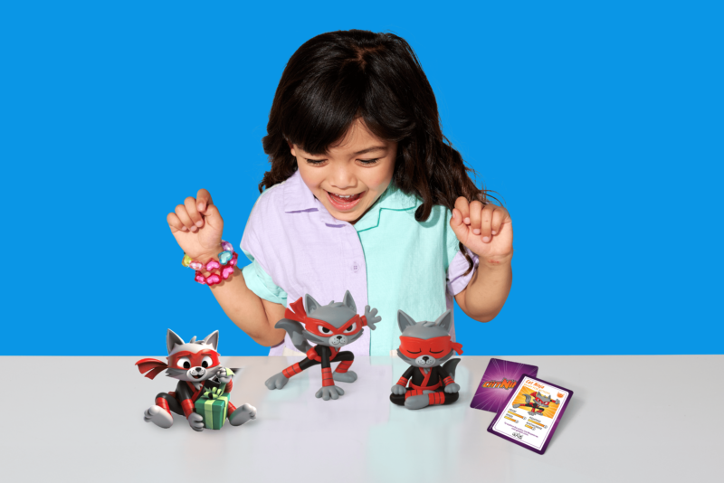 Child playing with Cat Ninja figurines, featuring the limited-edition Cat Ninja Toy collection inspired by the Cat Ninja Epic Originals book series.