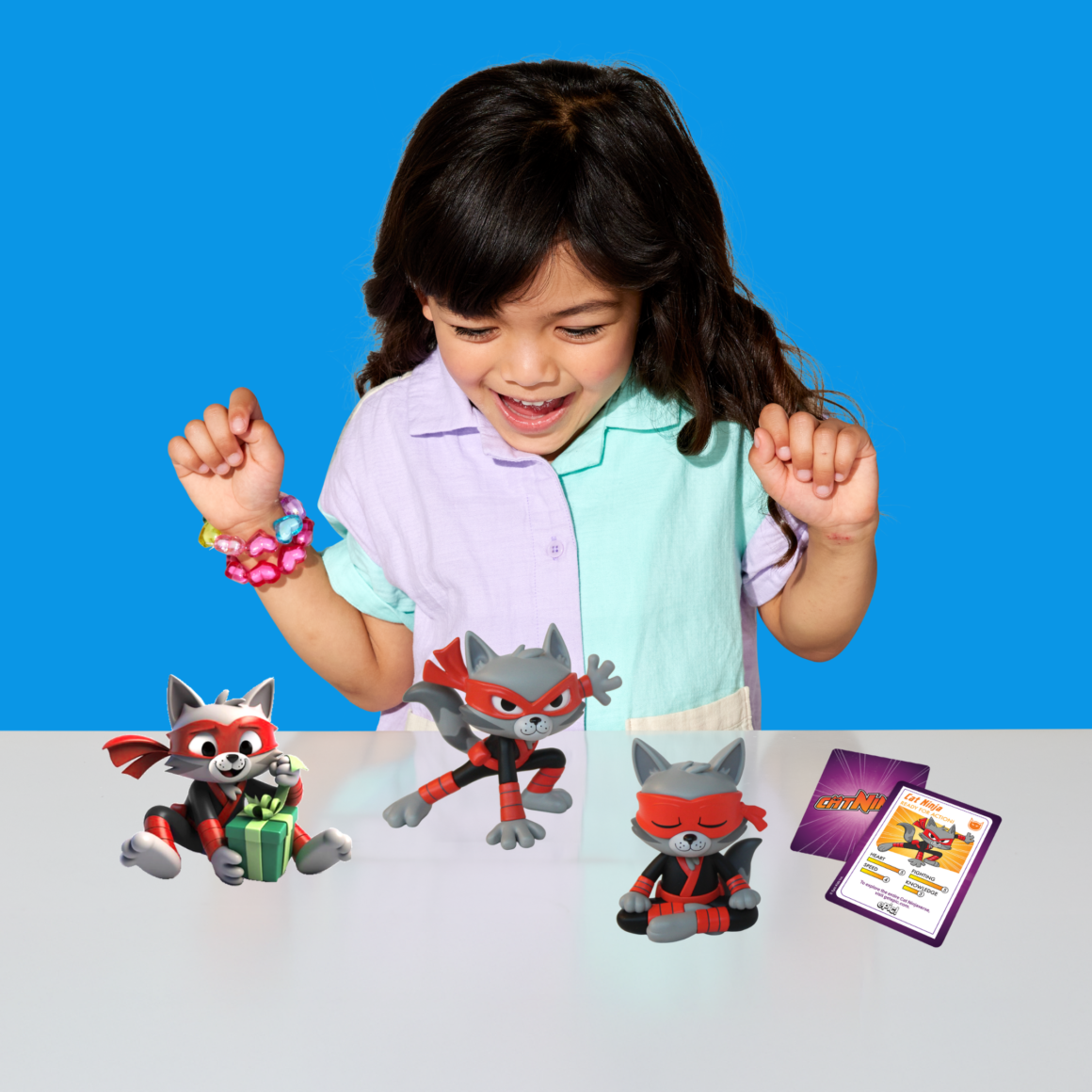 Child playing with a Cat Ninja figurine, based on the popular Epic Originals series