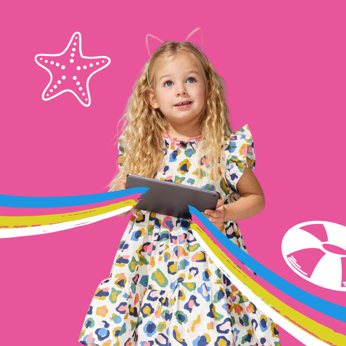 Young girl holding a tablet while enjoying summer learning and reading activities for elementary students