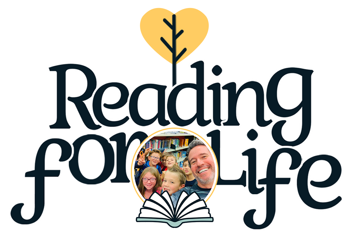 Reading for Life logo featuring a heart-shaped tree, open book and photo of founder Jeffrey Riley with students, representing a literacy program that builds lifelong reading habits.
